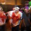 Photo: Zombies menace guests going through the Haunted Al Photo: Zombies menace guests going through the Haunted Al